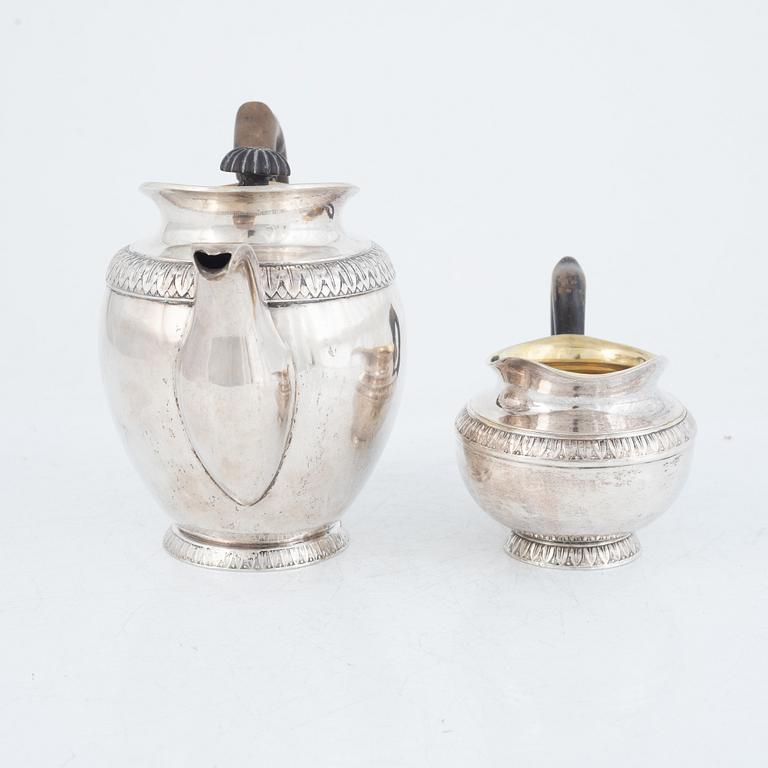 A Polish Silver Teapot and Creamer, Warsaw, 19th Century.