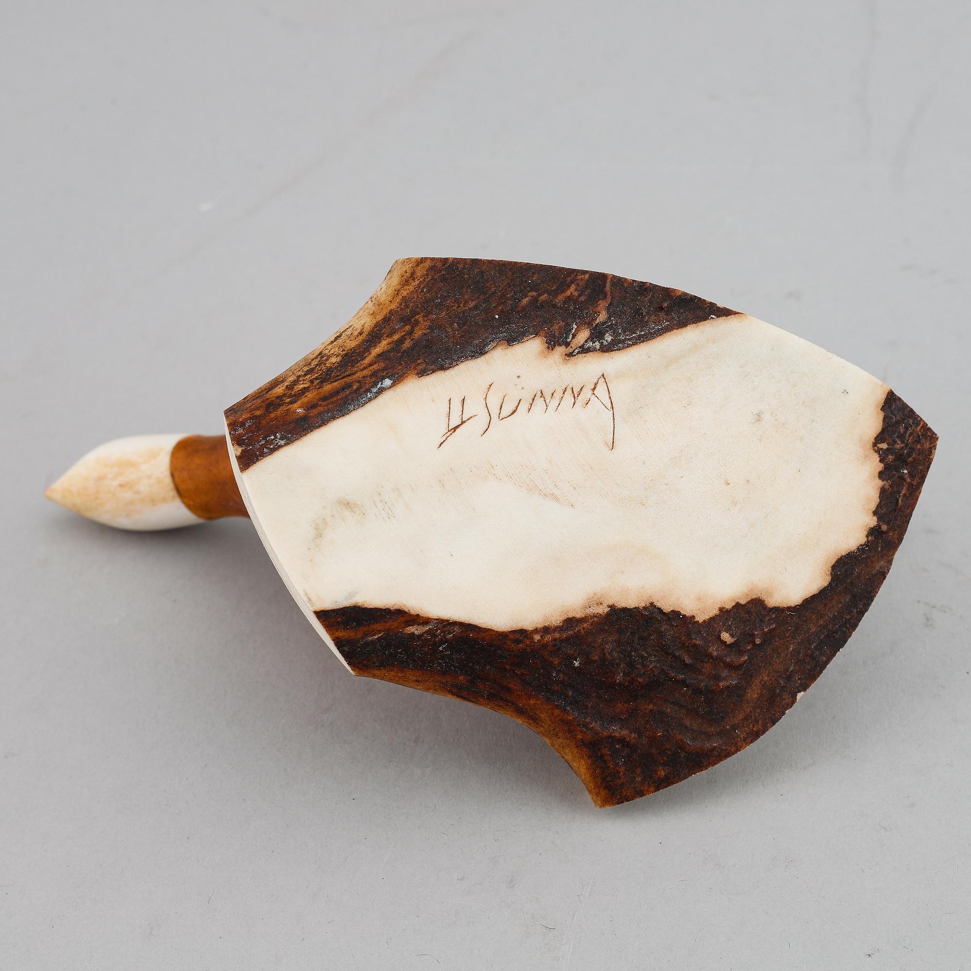 Lars Levi Sunna, a Sami reindeer horn and birch figurine of a grouse, signed LL Sunna.