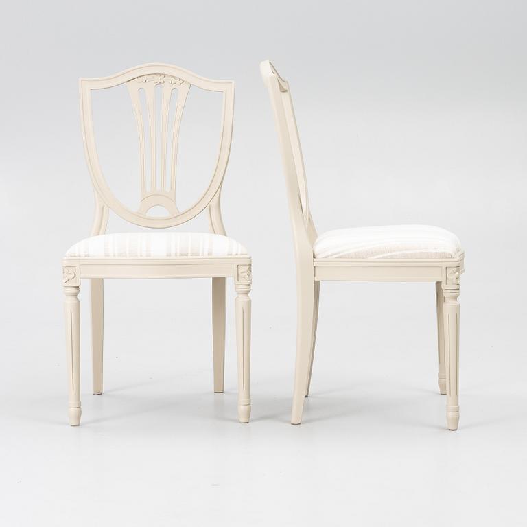 A dining table with 10 chairs, Gustavian Style dining suite, second half of the 20th century.