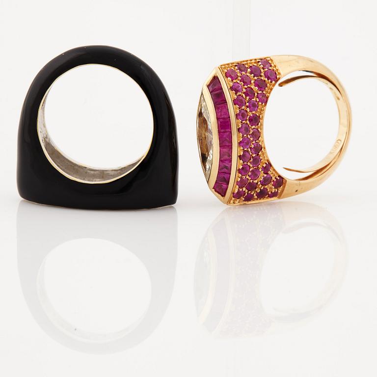 A ruby, diamond and black enamel ring.