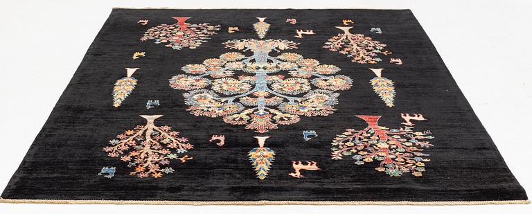 A figural oriental Carpet, circa 263 x 201 cm.