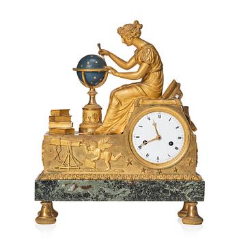 123. A patinated, ormolu, and marble French Empire figural mantel clock, early 19th century.