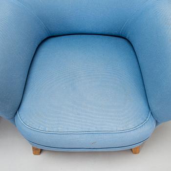 A pair of mid-20th-century armchairs.
