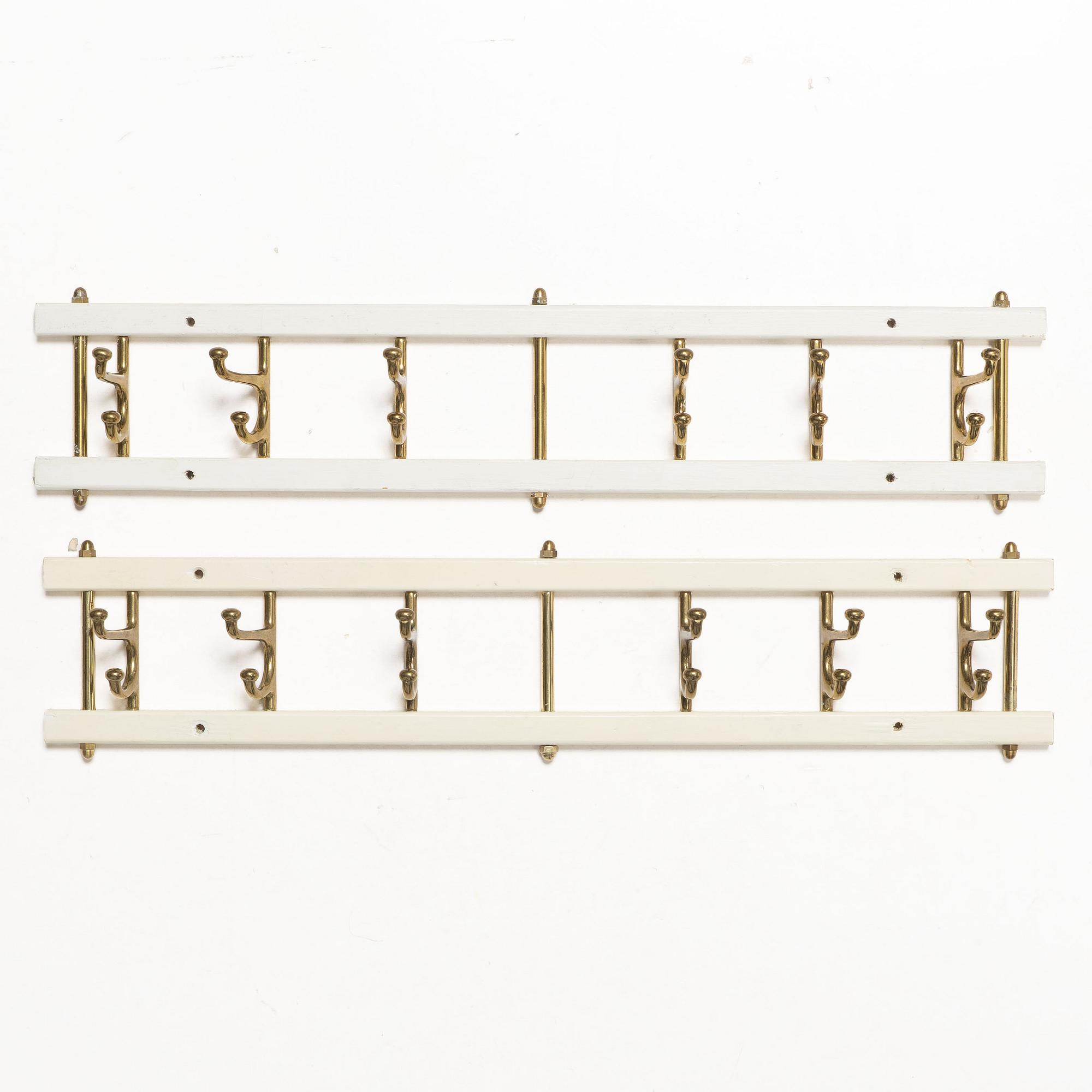Coat hangers, a pair, “Dekorativ”, Skoglunds Metallgjuteri, Anderstorp, mid-20th century.
