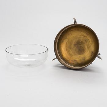 A early 20th-century Jugend Style brass bowl with glass liner.