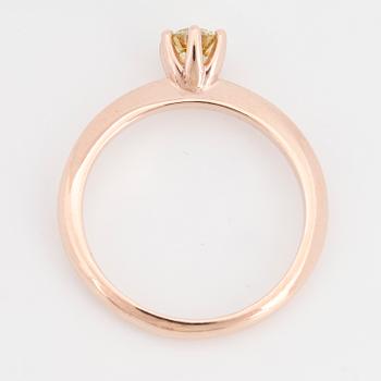 Colour treated yellow brilliant-cut diamond.