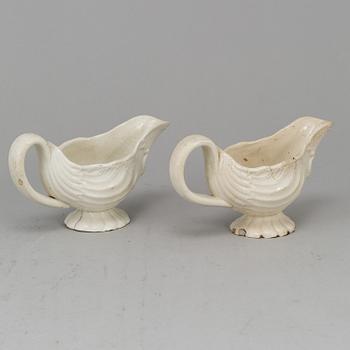 A creame weare buttertureen with cover, a cake mould and a pair of sauce boats, 18/19th Century, part Rörstrand.