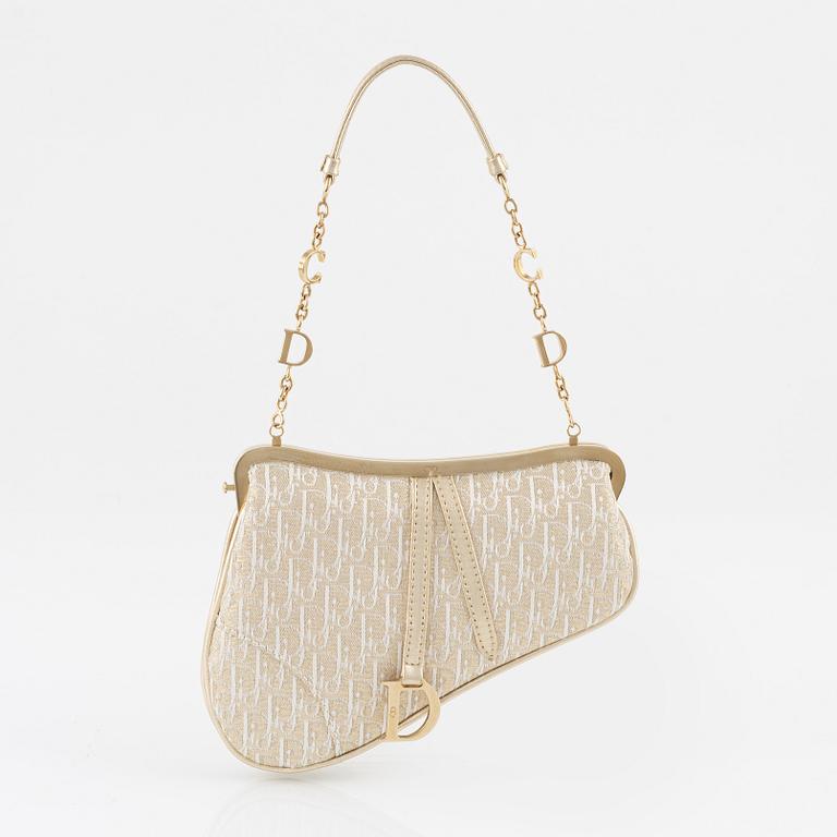 Christian Dior, A vintage 'Mini saddle clutch'.
