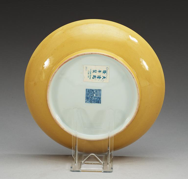 A yellow glazed dish, Qing dynasty, with Qianlong seal mark.