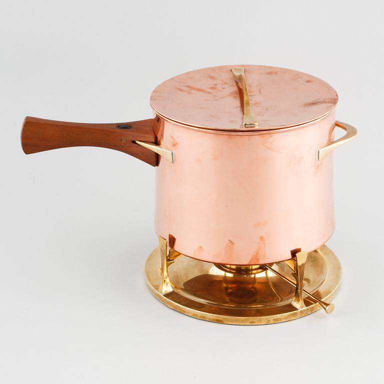 A copper pot with rechaud by Jens Quistgaard, third quarter of the 20th century.