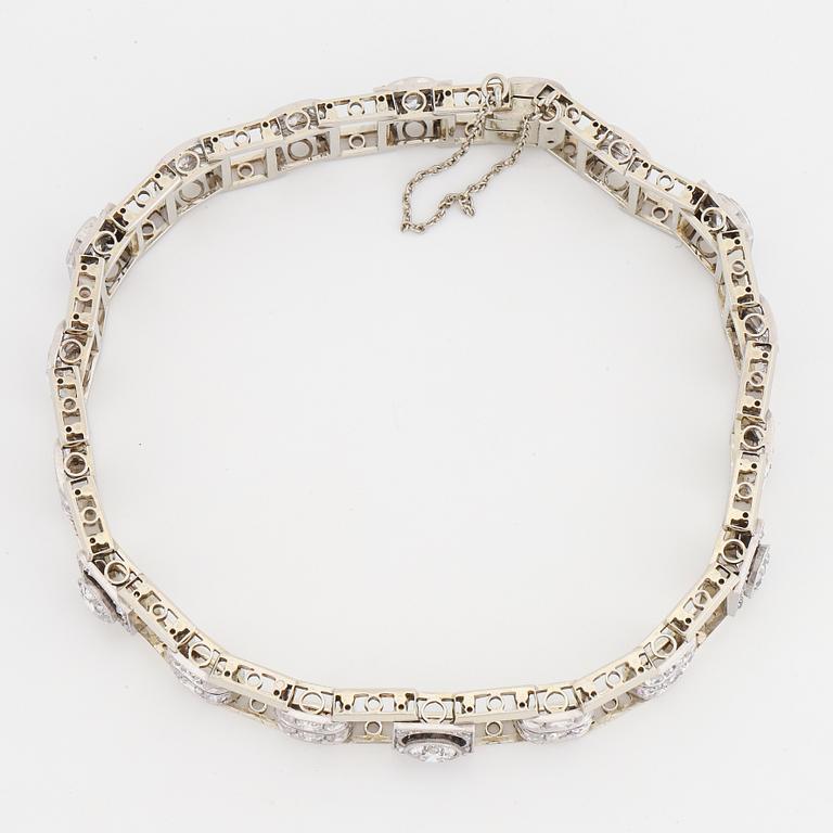 An 18K white gold bracelet set with old- and rose-cut diamonds.