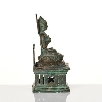 A bronze Buddha Vairocana, Eastern Java, 10th century.