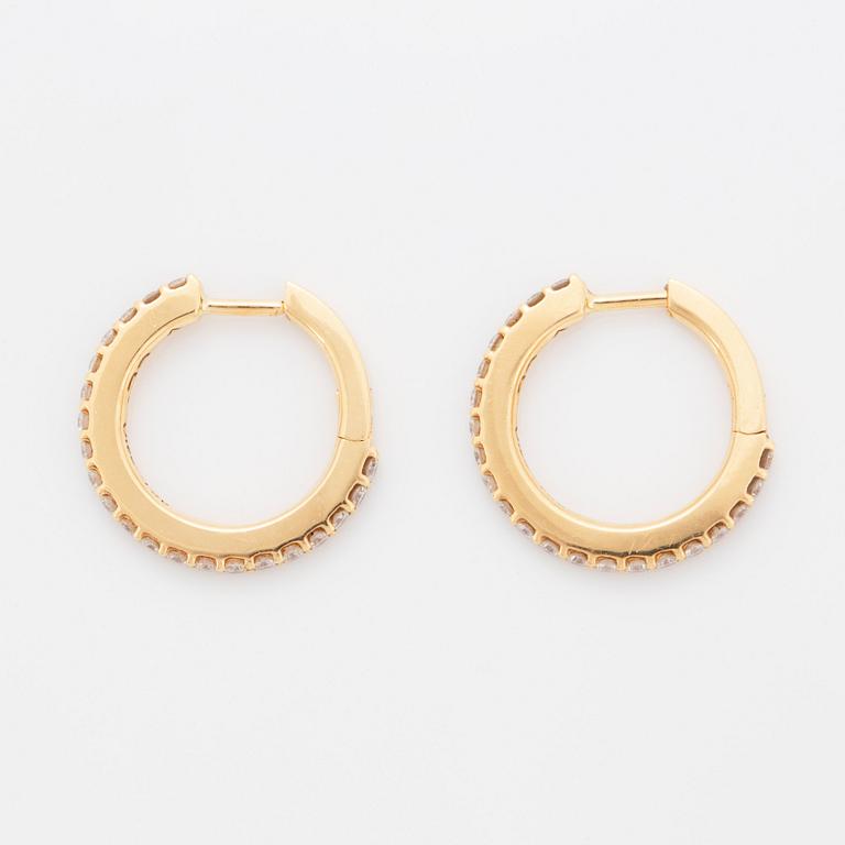 A pair of Ole Lynggaard earrings "Love" in 18K gold set with round brilliant-cut diamonds.