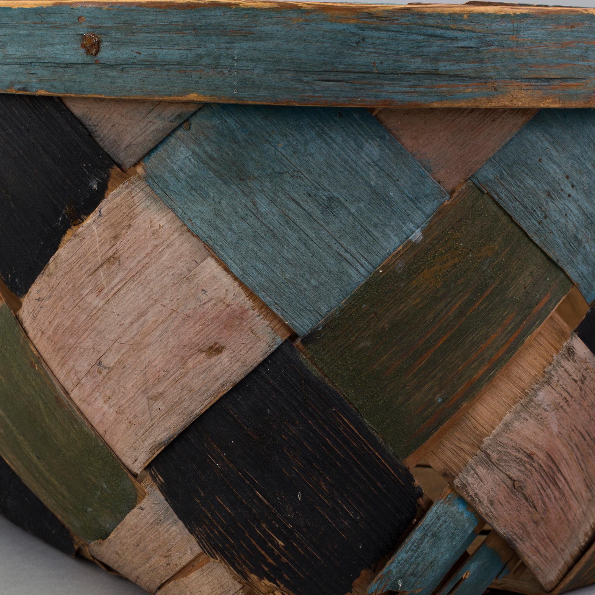 a painted basket from the 19th century.