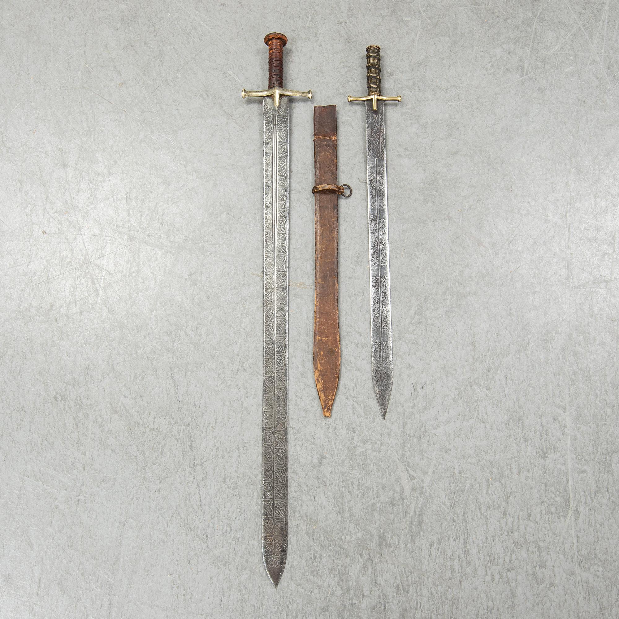 Two East African Kaskara swords- One with scabbard. 19-20th Century.