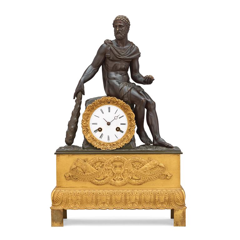 An Empire early 19th century gilt and patinated bronze mantel clock.