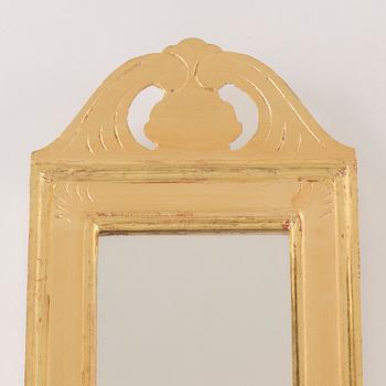 A 'Regnaholm' mirror wall sconse from IKEA. Originalbox included.