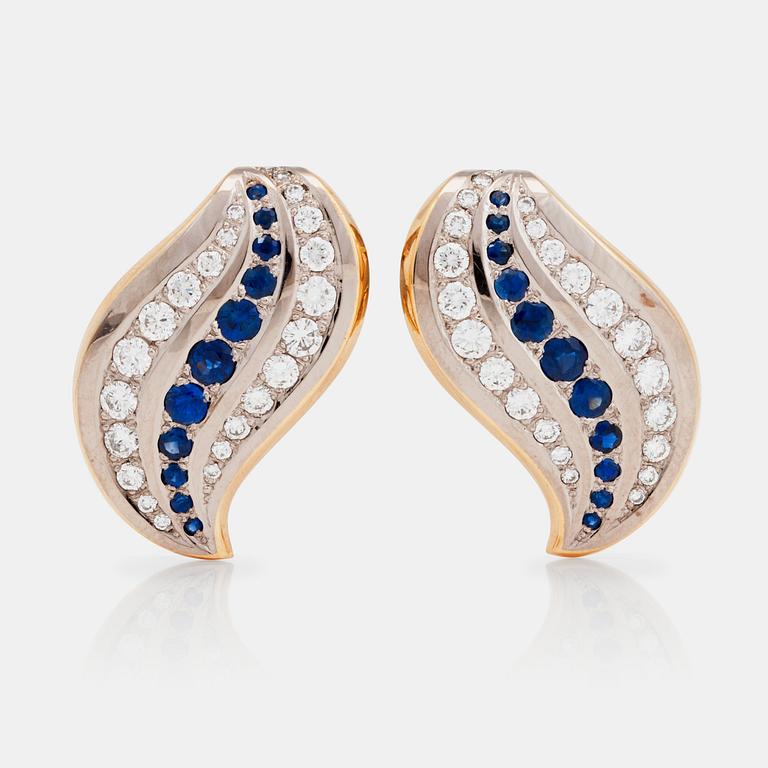 A pair of sapphire and diamond earrings.