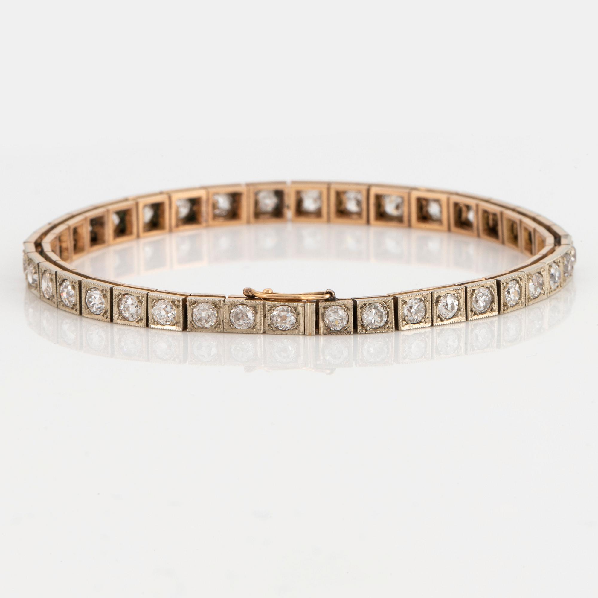 A 14K gold bracelet set with old-cut diamonds.