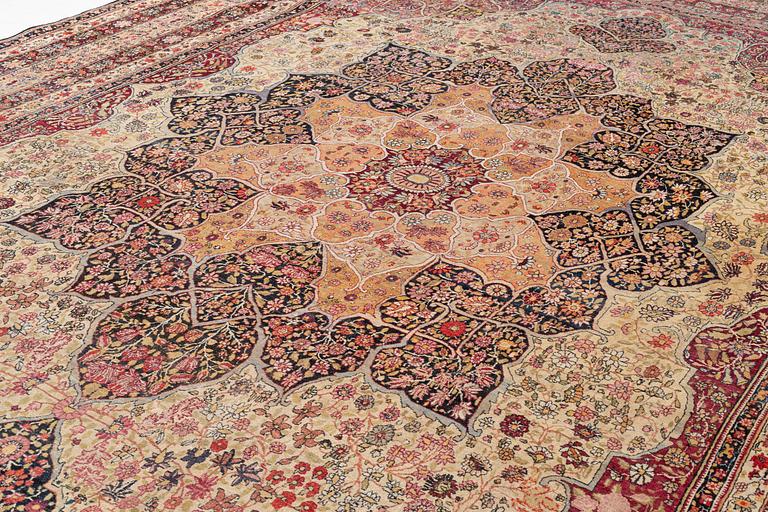 An antique Kerman Laver carpet, c. 586 x 385 cm.