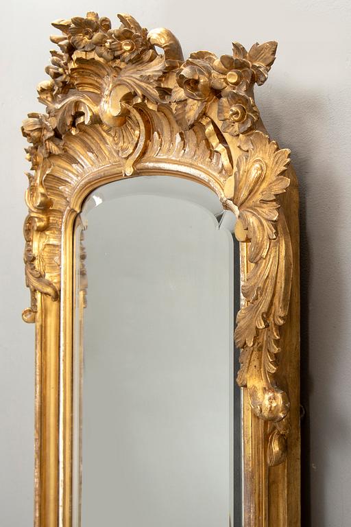 A Swedish Neo Rococo gilded signed mirror 1880s.
