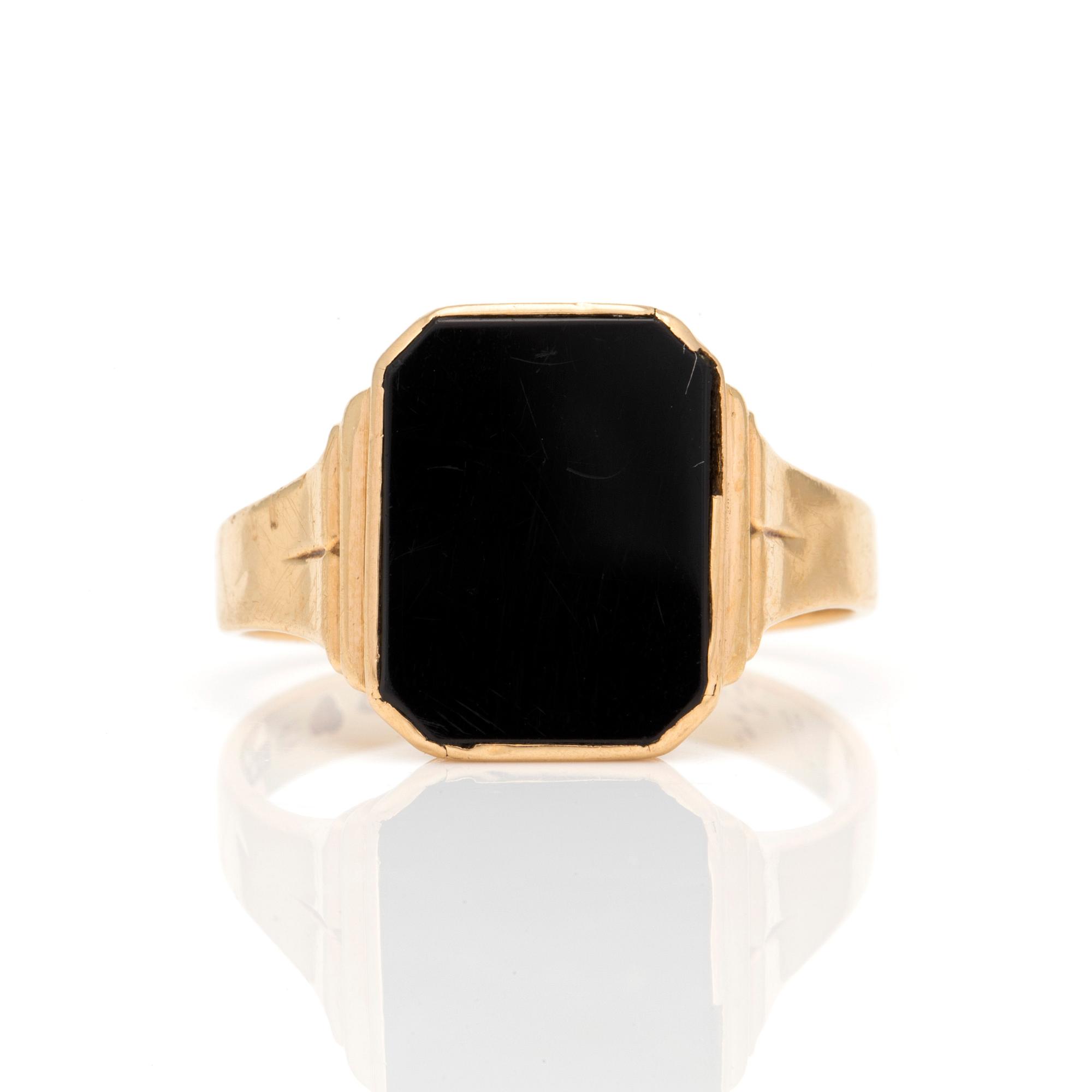 A signet ring set with onyx.