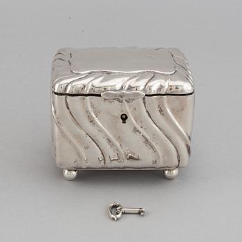 A 20th century parcel-gilt silver sugar-box, Swedish import marks from 1919.