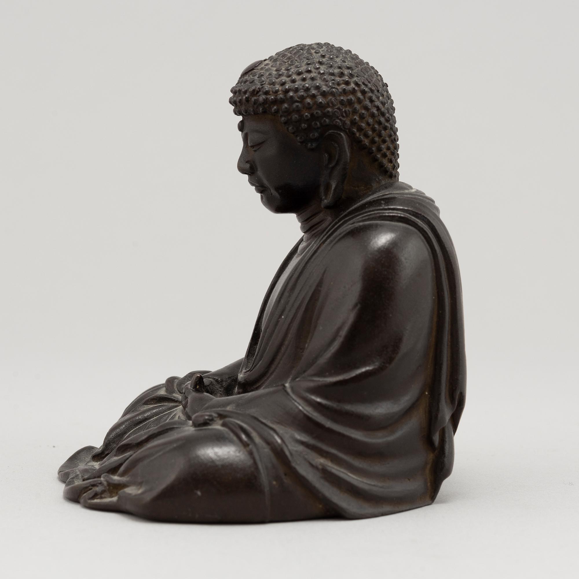 A Japanese seated bronze okimono of Amitabha buddha, 20th century.