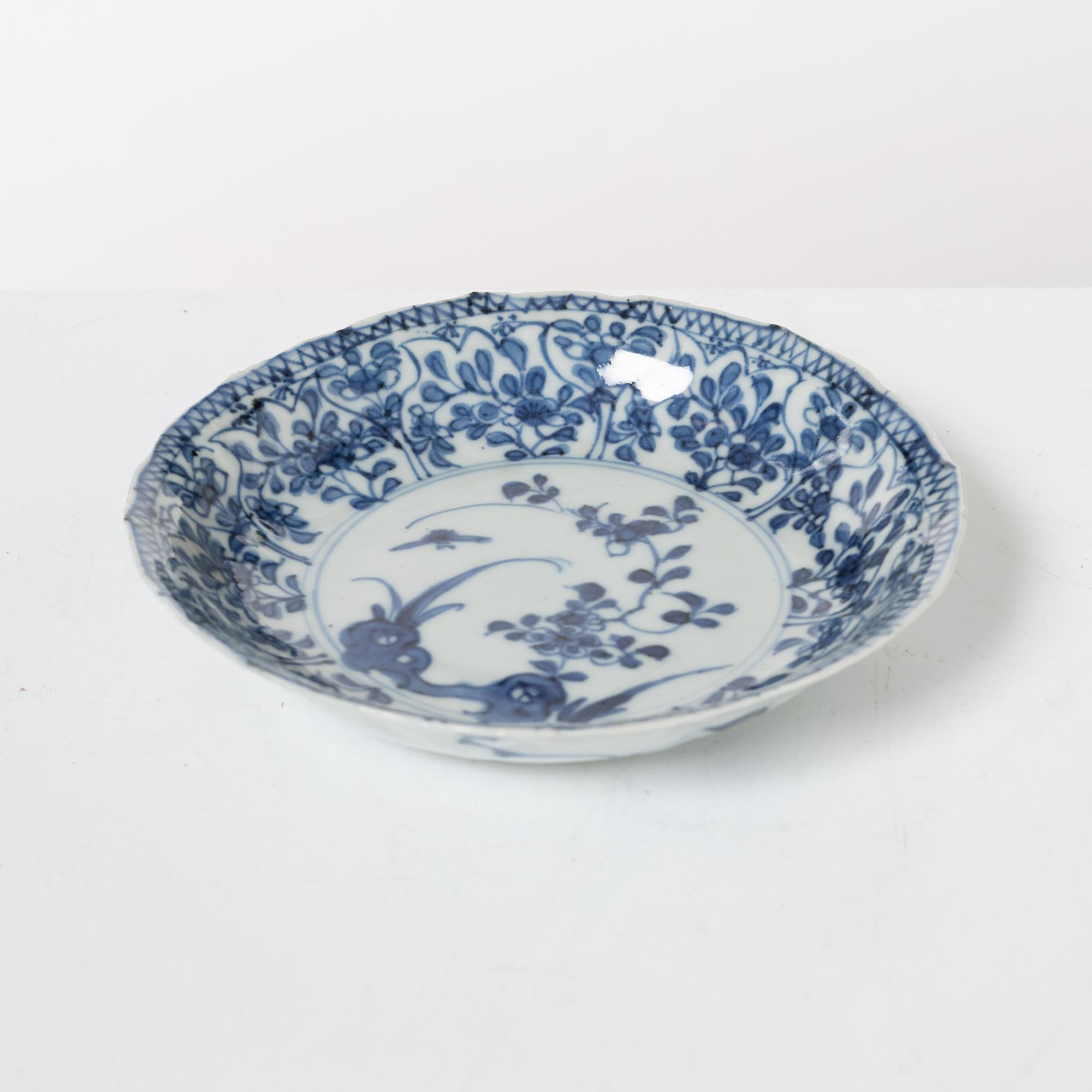 Two Chinese blue and white porcelain dishes and a small dish, Qing dynasty, 18th century.