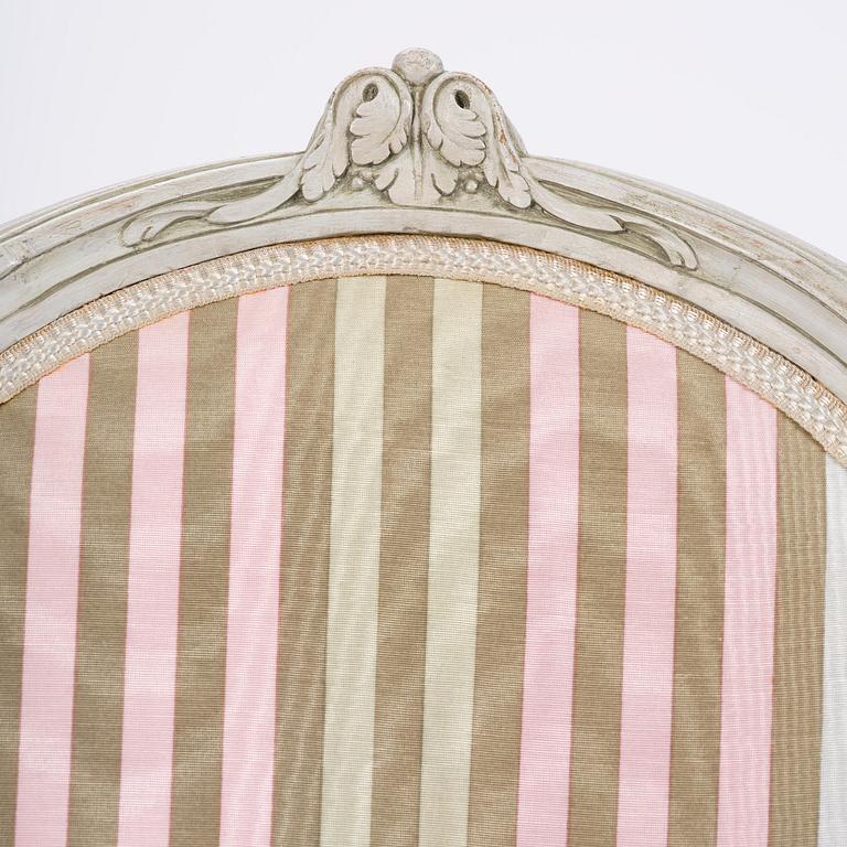 A pair of Gustavian open armchairs by E. Öhrmark (master in Stockholm 1777-1813).