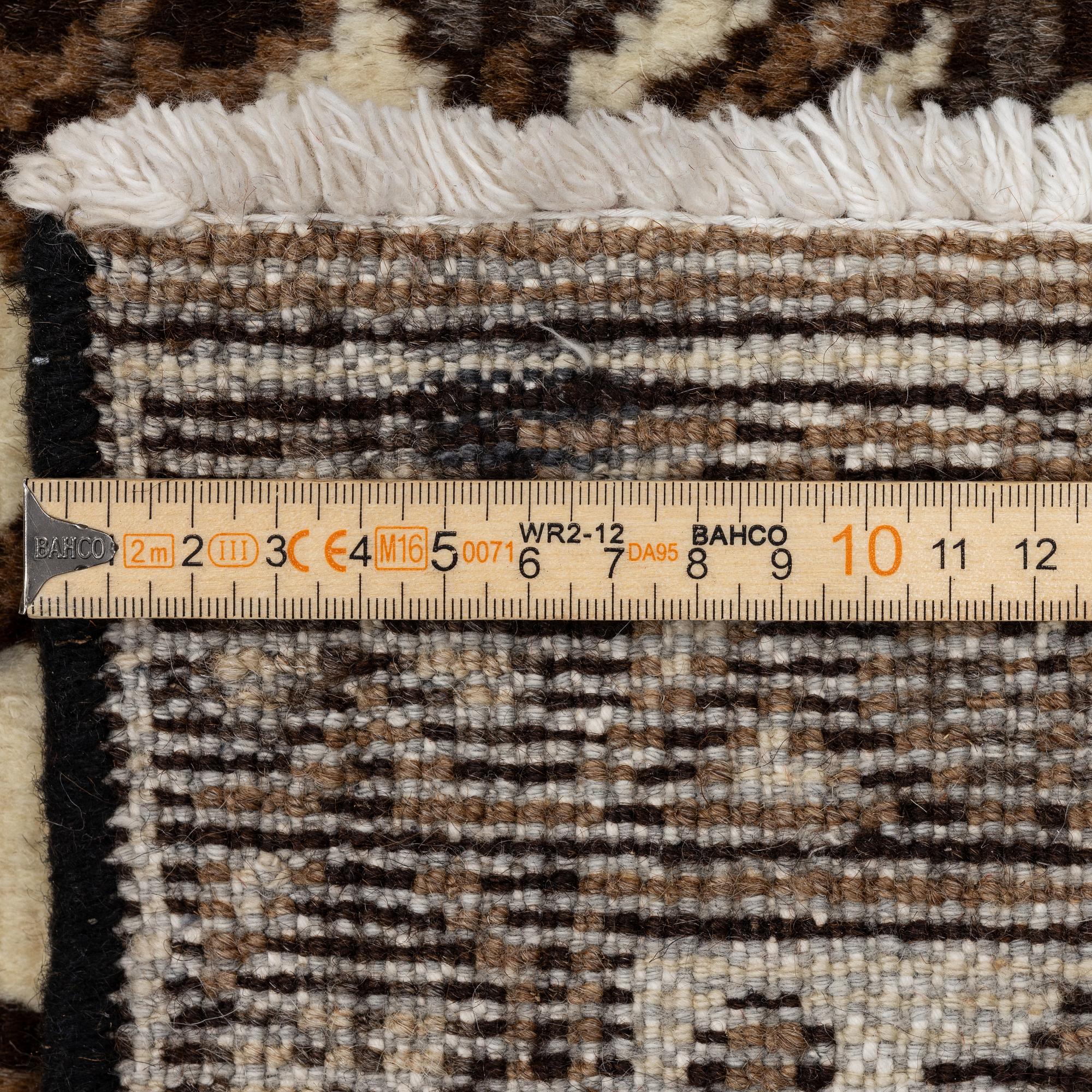 A Ferdos carpet, c. 295 x 210 cm.