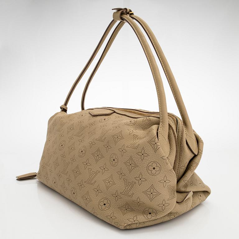 Louis Vuitton, a 'Mahina Galatea MM' bag.