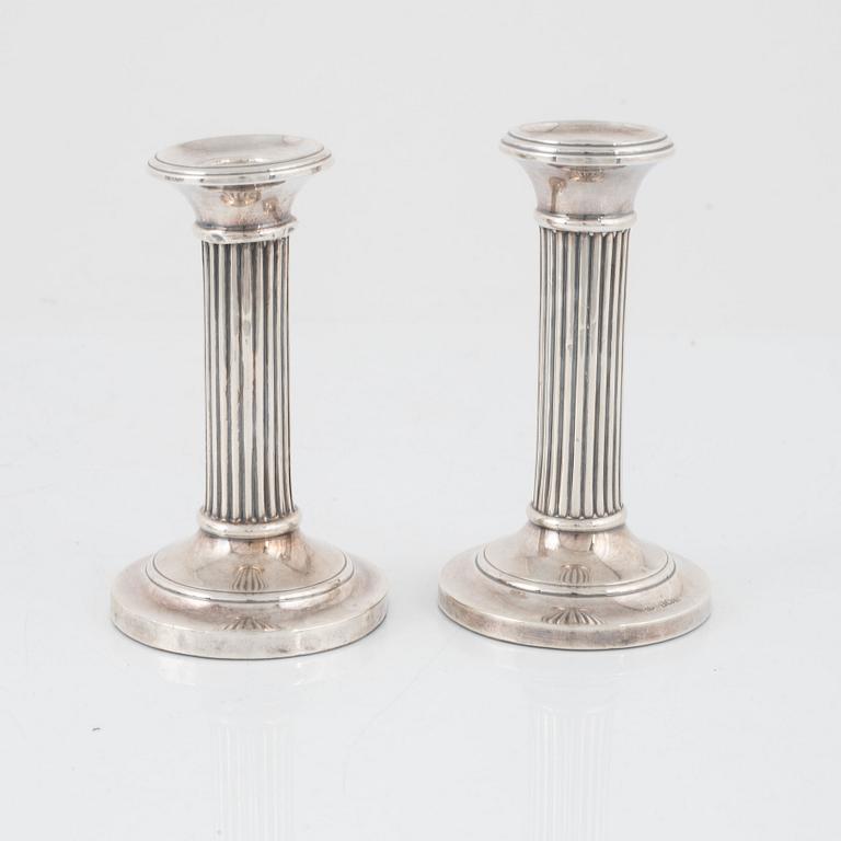 A pair of silver candlesticks, Boots Pure Drug Company, Birmingham, England, 1905-1909.