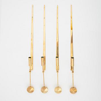 Pierre Forssell, a set of four brass 'Pendeln' wall lights from Skultuna, late 20th Century.