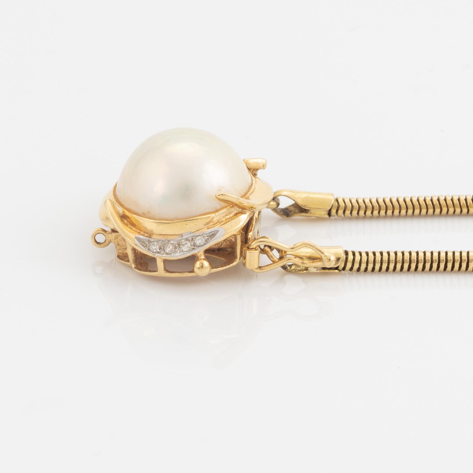 Mabe pearl and brilliant cut diamond earrings and necklace.