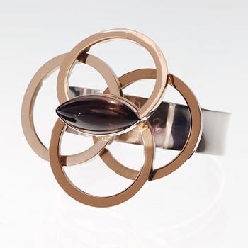A Sigurd Persson sterling, partly gilt, bangle with a cabochon cut smoke topaz, Stockholm 1962.