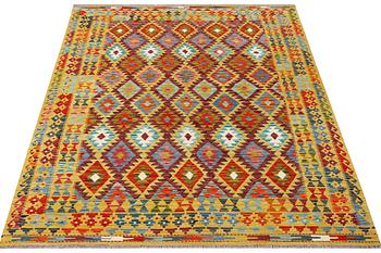 A Kilim rug, c. 240 x 181 cm.