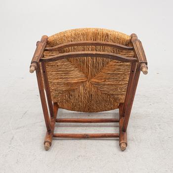 A French walnut open armchair, first part 19th century.