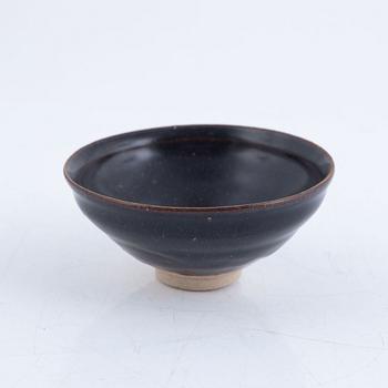 A tenmoku glazed Song style bowl, probably later.