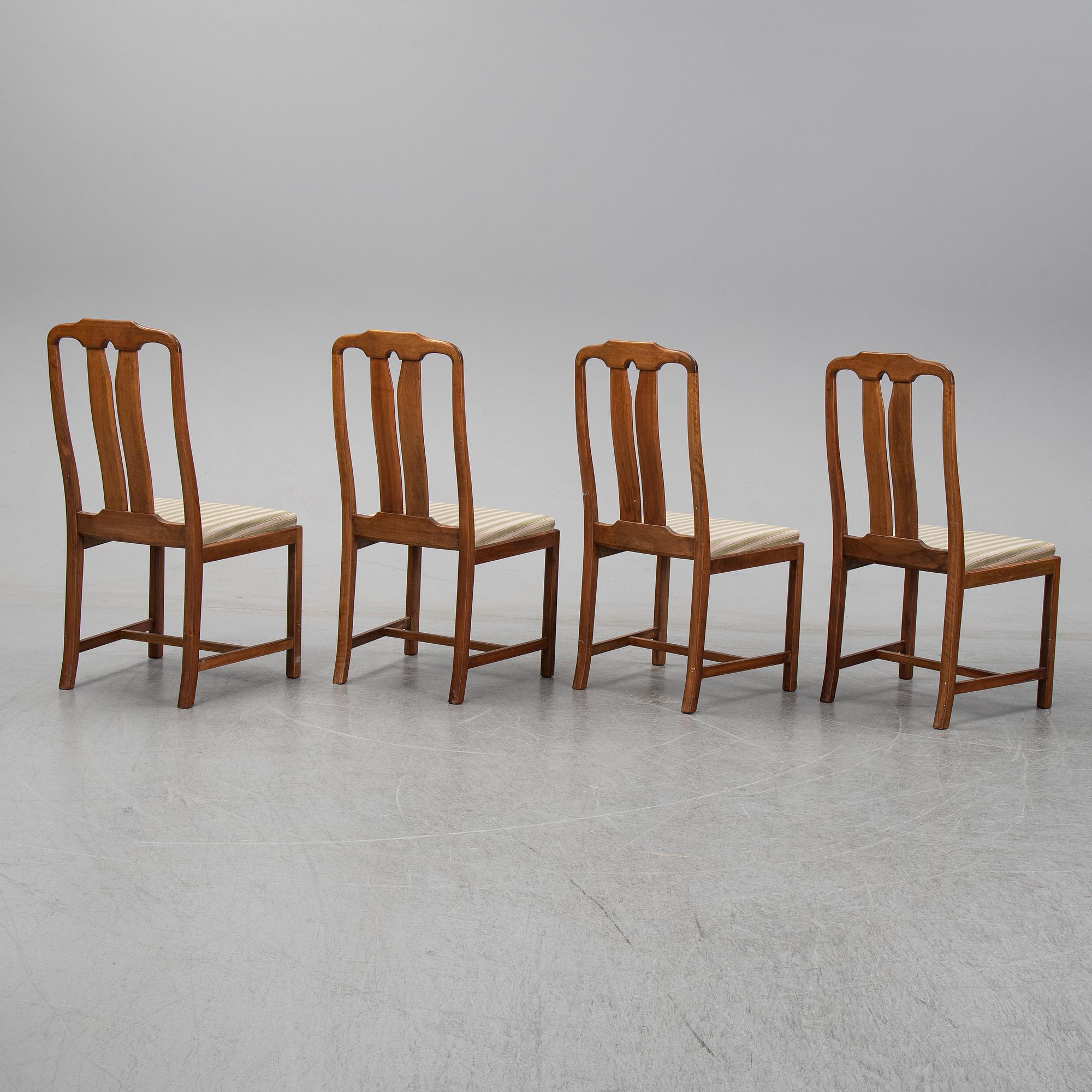 Carl Malmsten, A five-piece walnut 'Ambassadör' dining suite by Carl Malmsten.