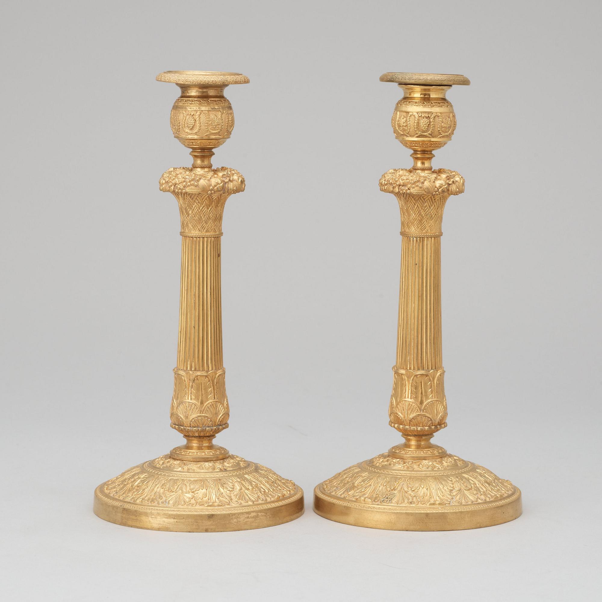 A pair of French Empire early 19th century candlesticks.