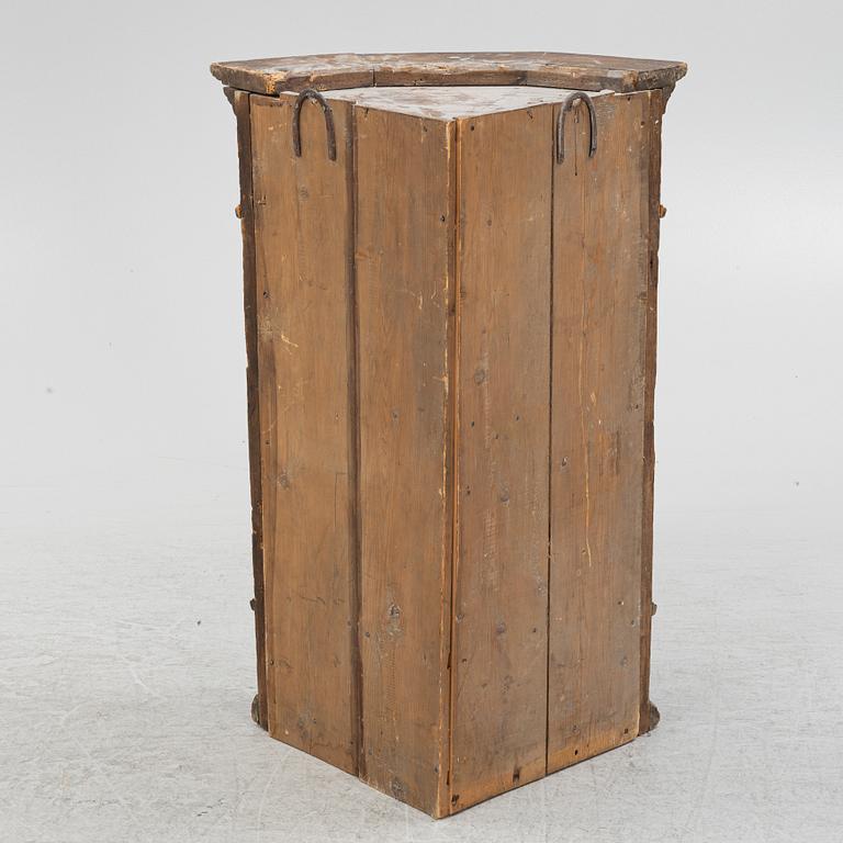 A Swedish provincial corner cabinet, dated 1790.