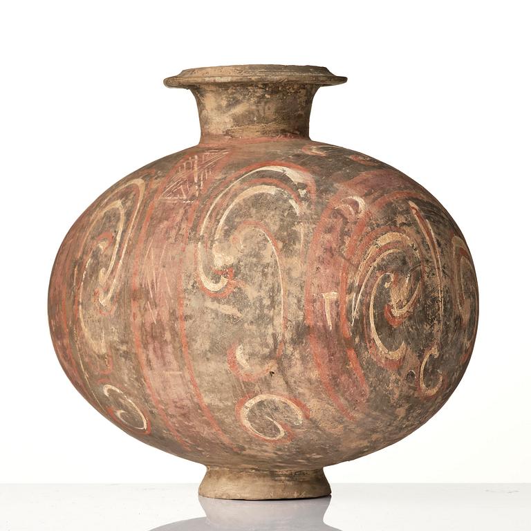 A well-painted dark grey pottery cocoon jar, 
Han dynasty (206 BC-AD 220).