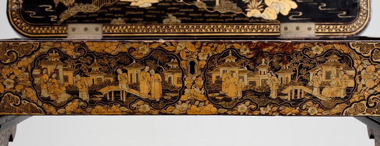 A gold and black lacquer sewing table, Qing dynasty, ca 1800.