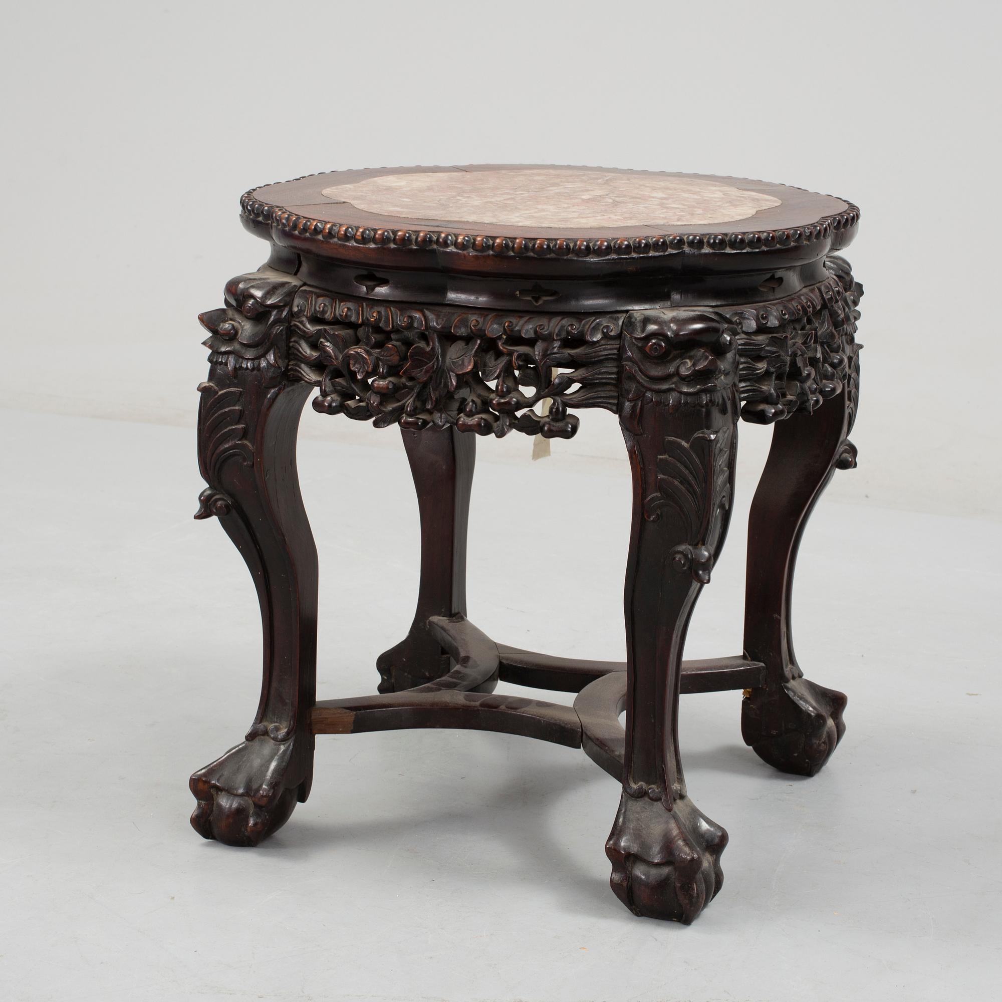 A Chinese hardwood table with marble top, 20th Century.