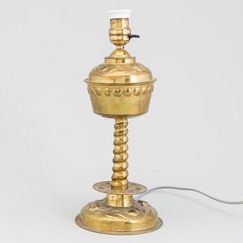 A brass baroque-style table lamp, first half of 20 th century.