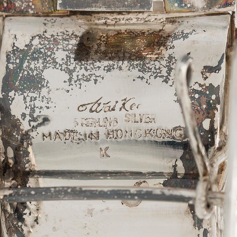 Four shakers in a pair of miniature rickshaws, sterling silver, maker's mark of Wai Kee, Hong Kong.