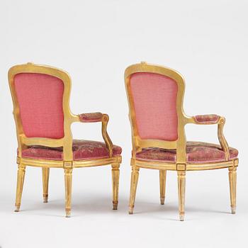 A pair of Gustavian giltwood open armchairs, Stockholm, late 18th century.
