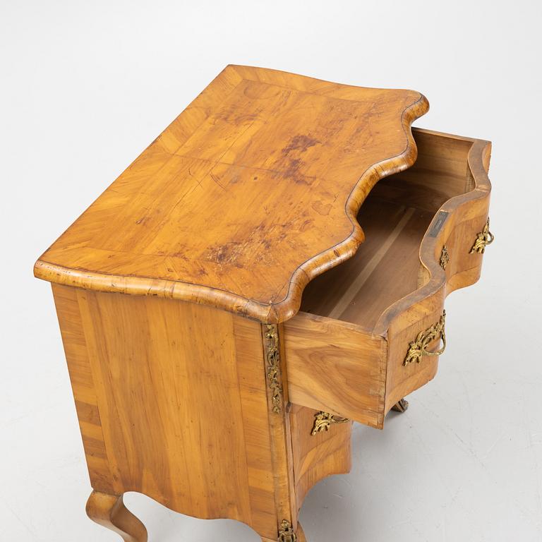 A late Baroque style chest of drawers., early 20th Century.