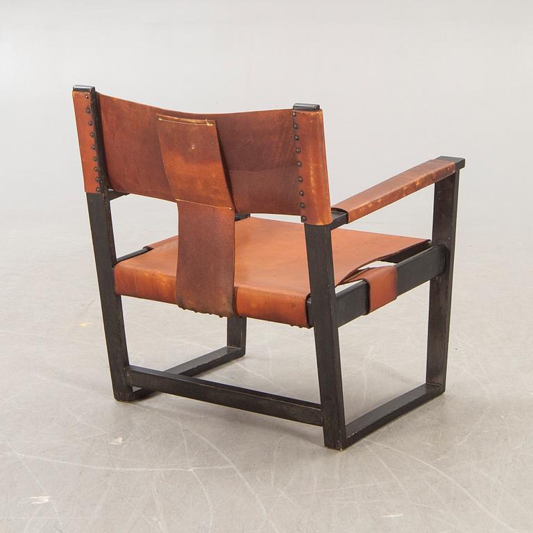 A 1960s leather easy chair.